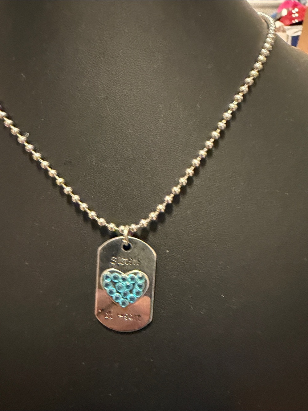 Silver tone sister at heart Tag Necklace with Blue Heart Accent by Claire’s